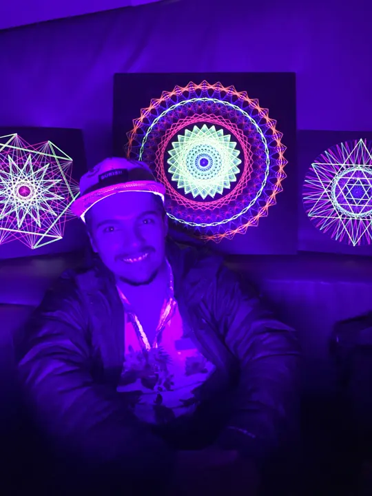 String art with neon string under blacklight