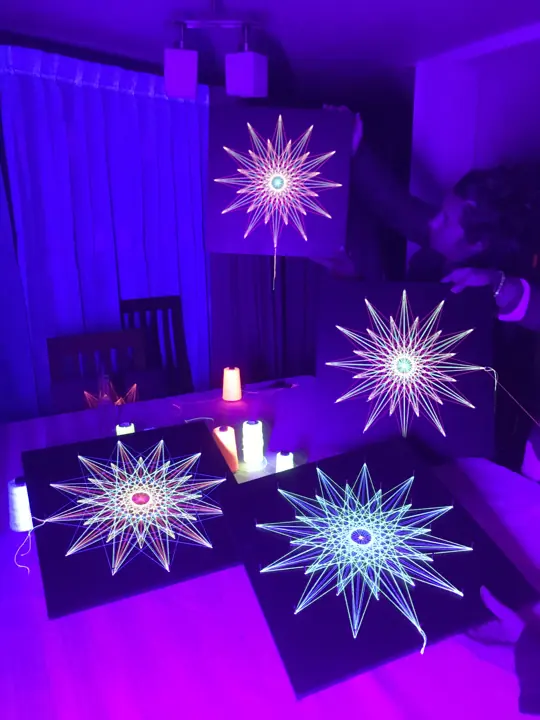 String art with neon string under blacklight
