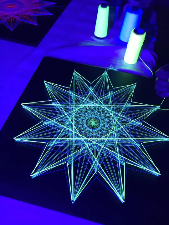 String art with neon string under blacklight