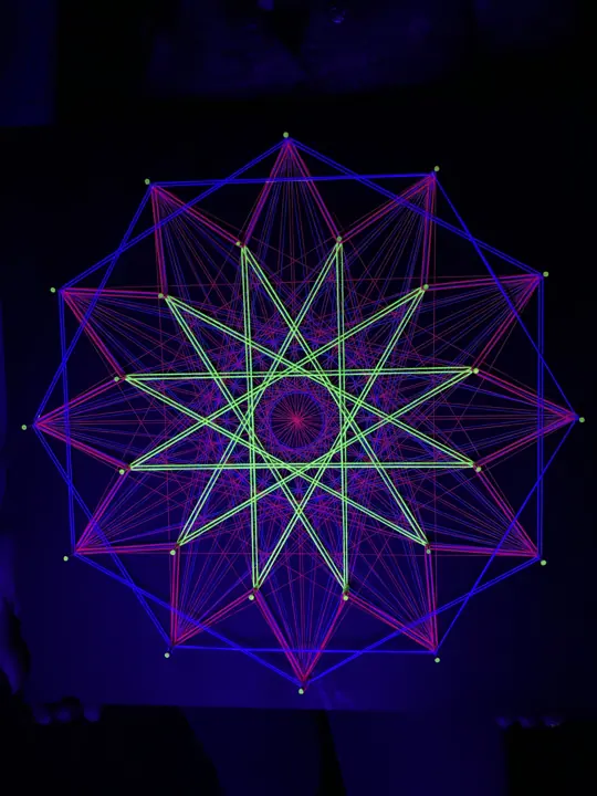 String art with neon string under blacklight