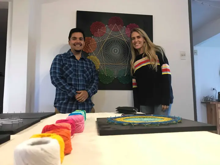 Group from a Fractalería string art workshop with their pieces